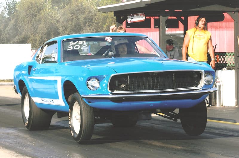 Blue 1969 Mustang on the dragstrip